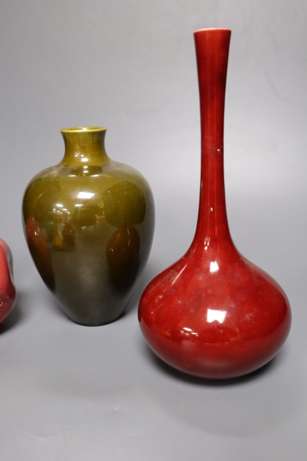 A collection of Burmantofts faience pottery vases, H 9cm to 23cm